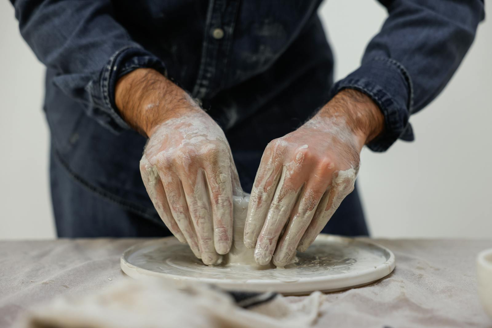 An Artist Molding Clay